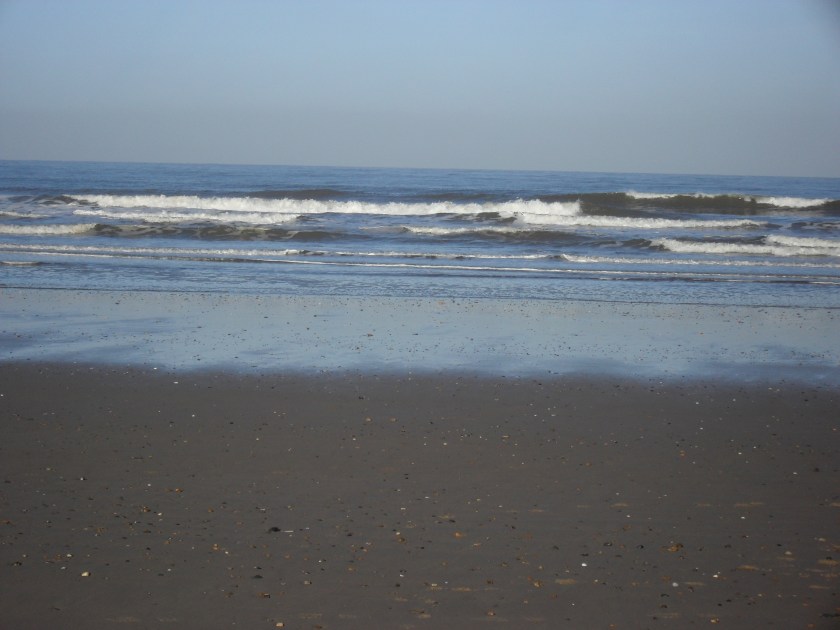 Waves crashing onto Holkham Beach
