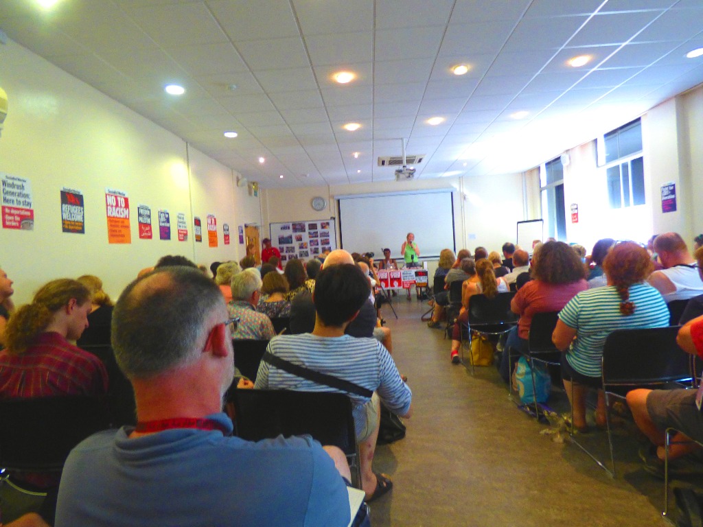 The scene as Eileen addresses the meeting