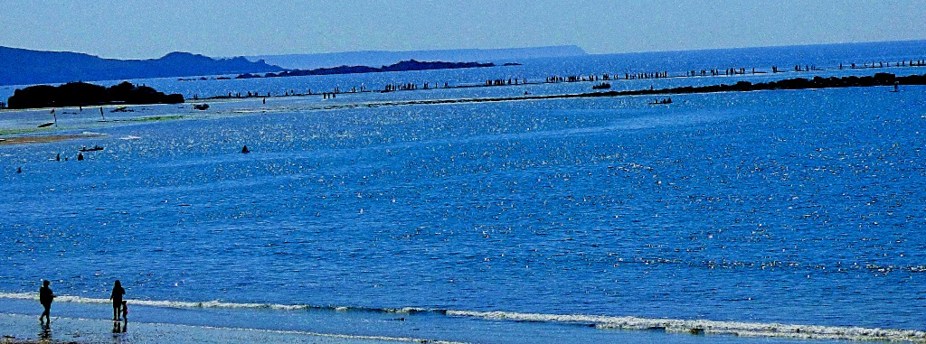 People crossing the causeway to the mount
