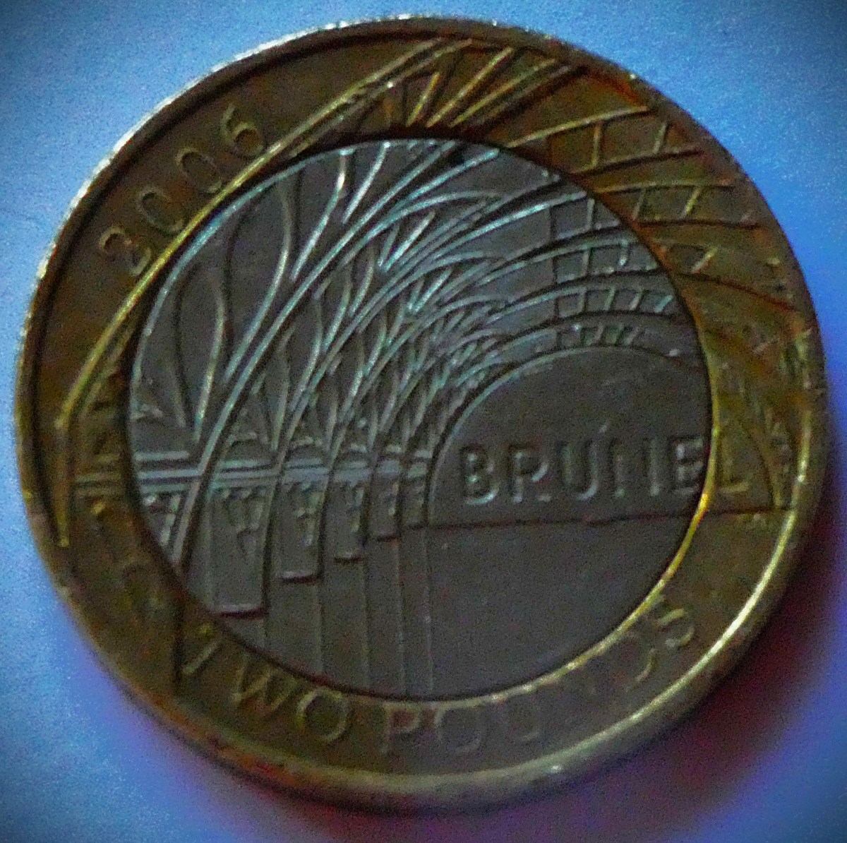 A Brunel £2 coin I got in change recently (I have proof copies of both this and the other Brunel themed £2 issued in 2006). The coin is two tone gold and silver as with all £2 coins, and the picture is a representation of the arched roof of Paddington station, London terminus of Brunel's Great Western Railway.