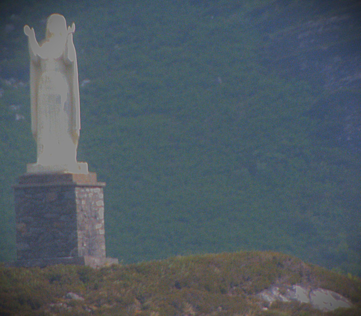 A statue/ monument which is located at the high point of a small headland somewhere between Mallaig and the Knoydart peninsula.